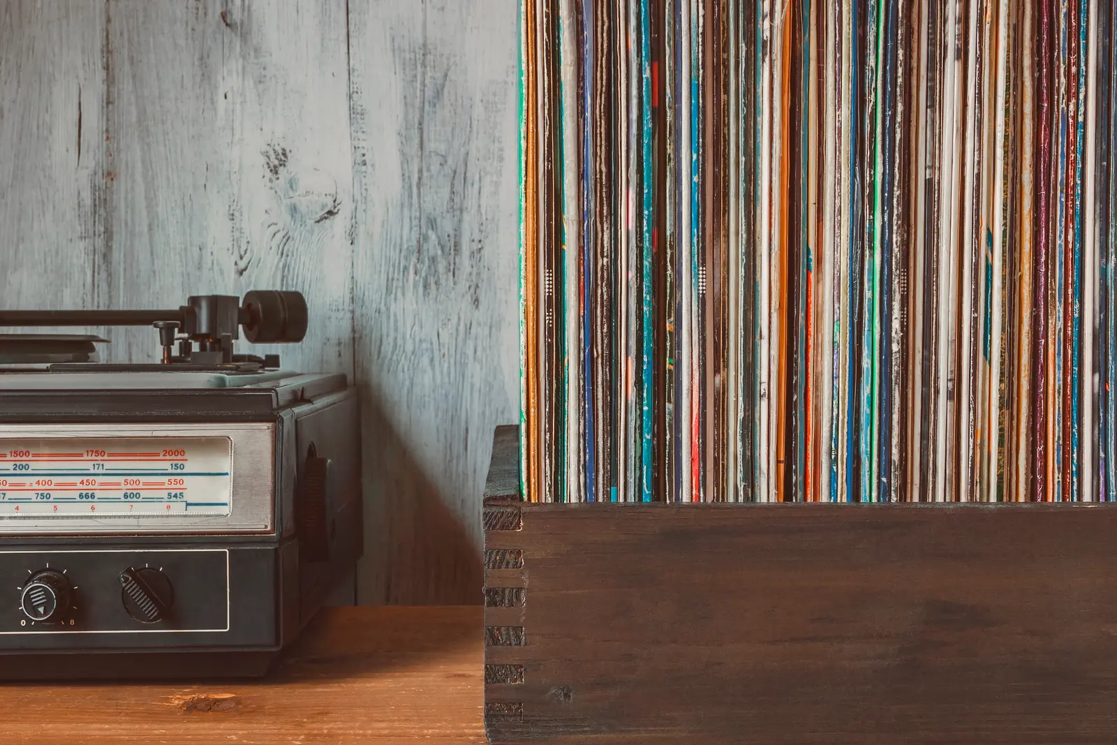 Vinyl records next to a turntable
