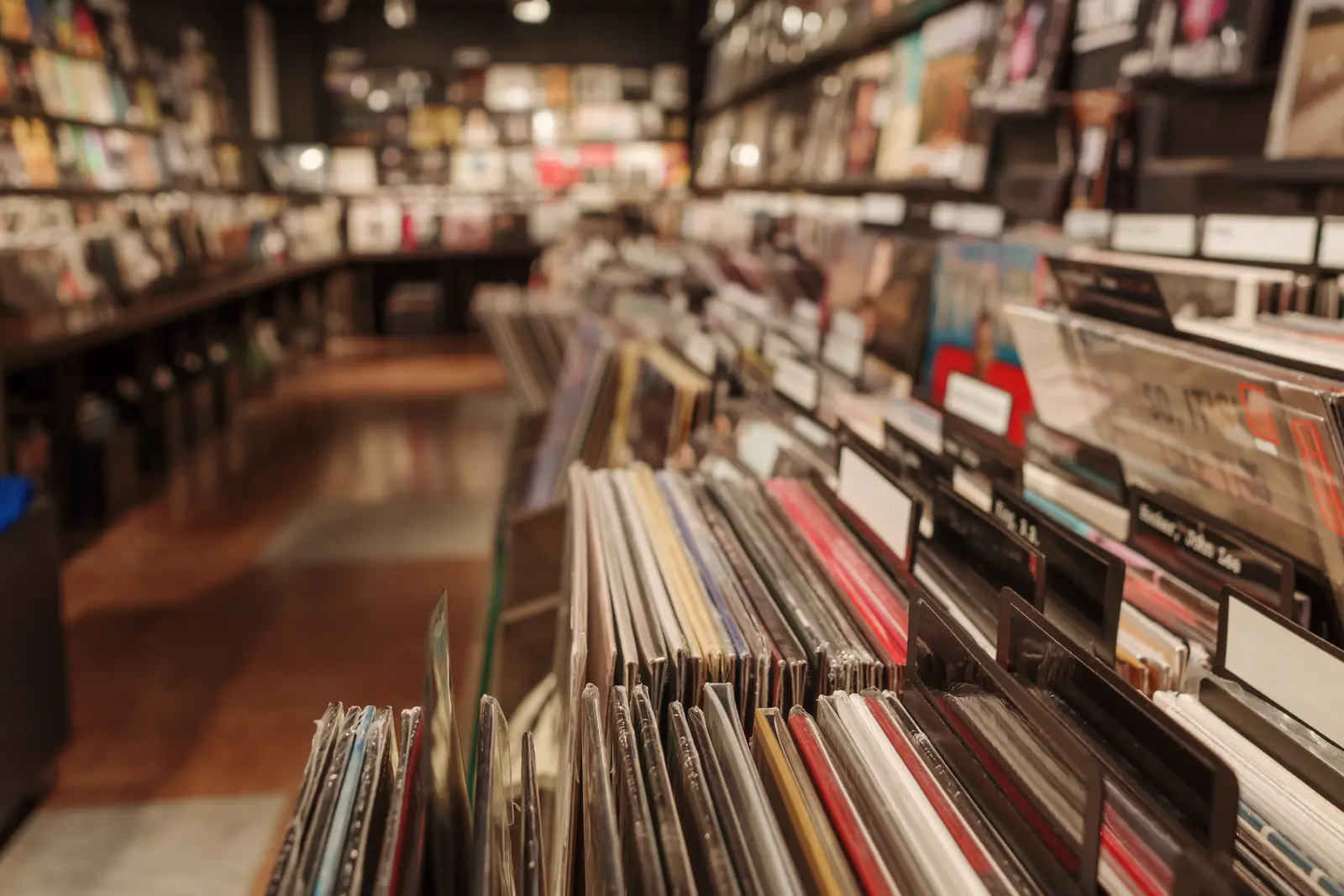 Rows of records in a music store aisle